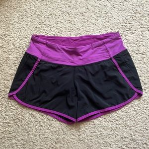 Women’s Lululemon Athletica running shorts purple and black size 4